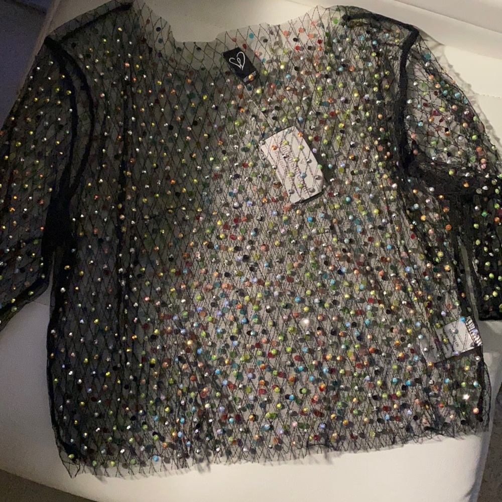 Windsor cute mesh top that has multicolored rhinestones.